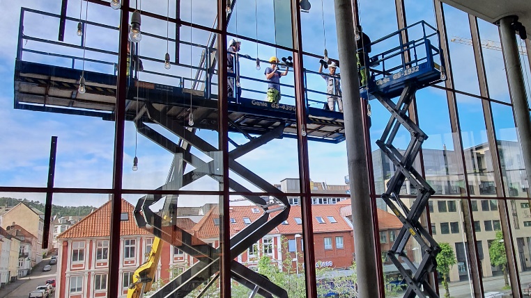 A picture containing outdoor, scaffolding, roof