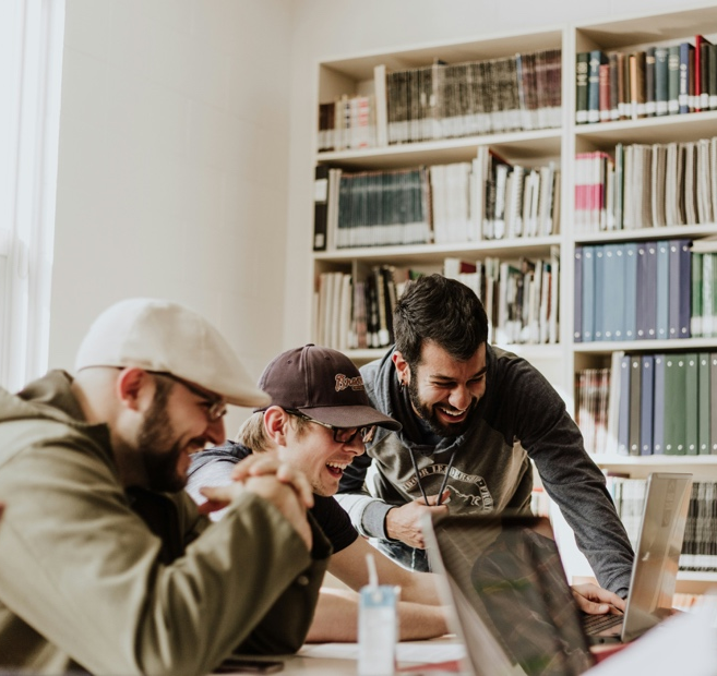A group of people looking at a computer

AI-generated content may be incorrect.