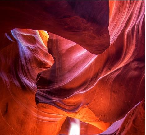 A light shining through a canyon