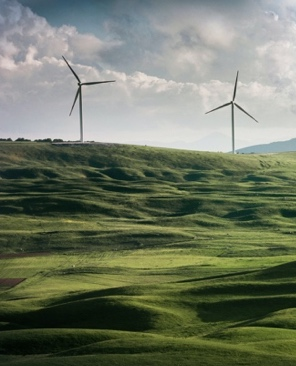 Wind turbines on a green hill