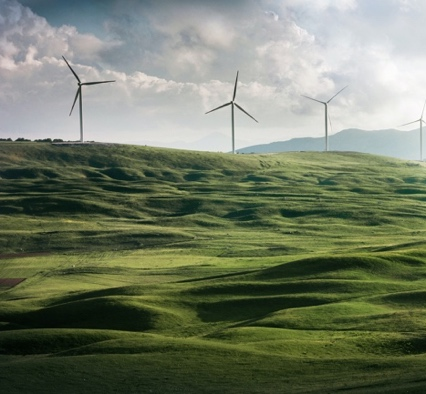 Wind turbines on a green hill