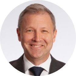 A person in a suit and tie

AI-generated content may be incorrect.