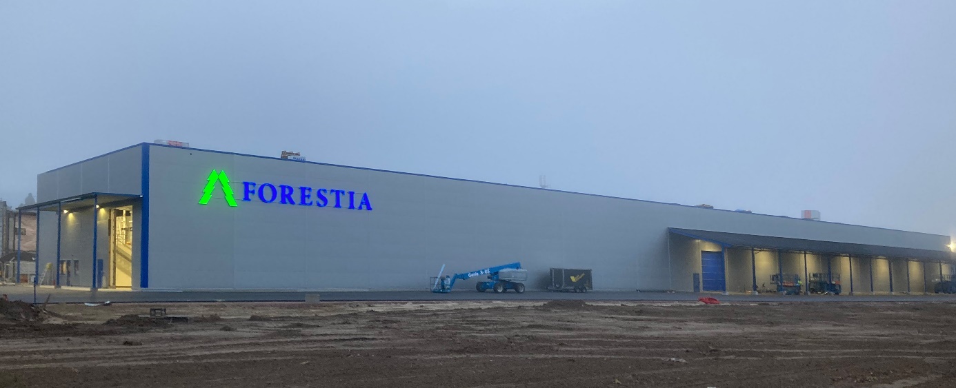 A picture containing sky, outdoor, building, warehouse