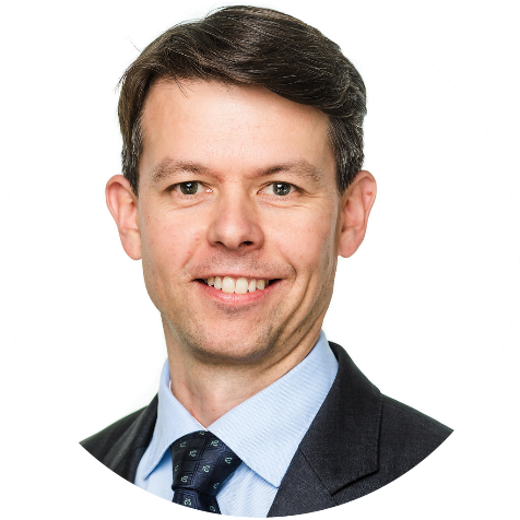 A person in a suit and tie

AI-generated content may be incorrect.
