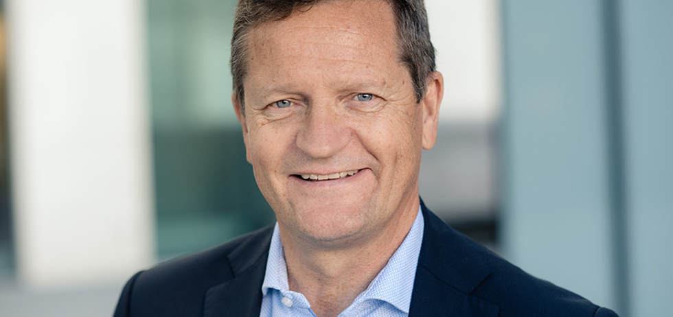 A person smiling for the picture

Description automatically generated with low confidence