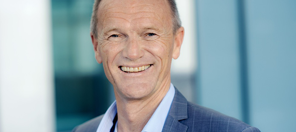 A person smiling for the picture

Description automatically generated with low confidence