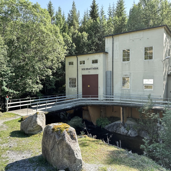 A building with a bridge over a river

AI-generated content may be incorrect.